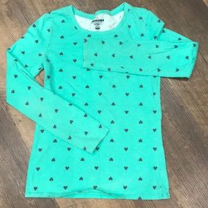 Green shirt with black hearts